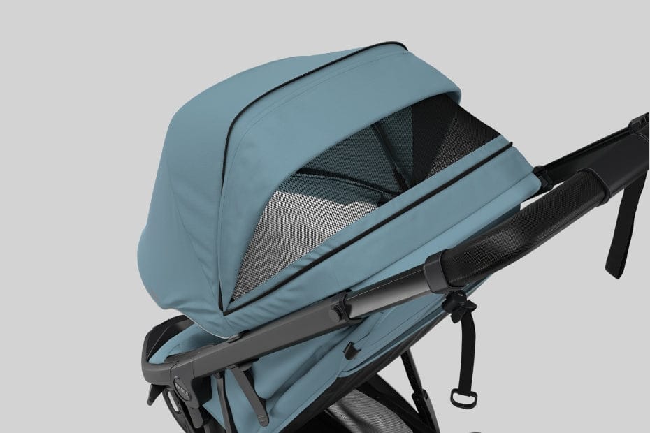 Light blue stroller with black frame and mesh canopy, angled view against neutral background.