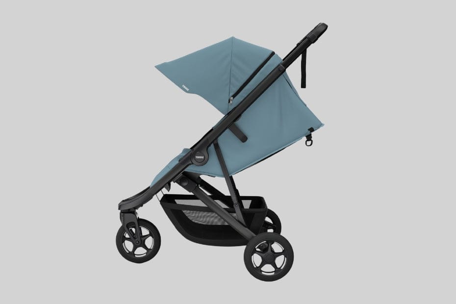 Light blue and black stroller with large canopy, four wheels, and front storage basket on neutral background.