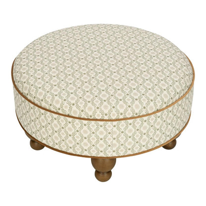 Babyletto round ottoman with green and cream geometric pattern and wooden ball feet