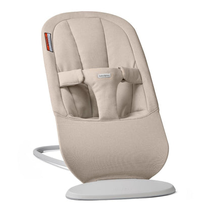 Beige BabyBjorn baby bouncer with a grey frame