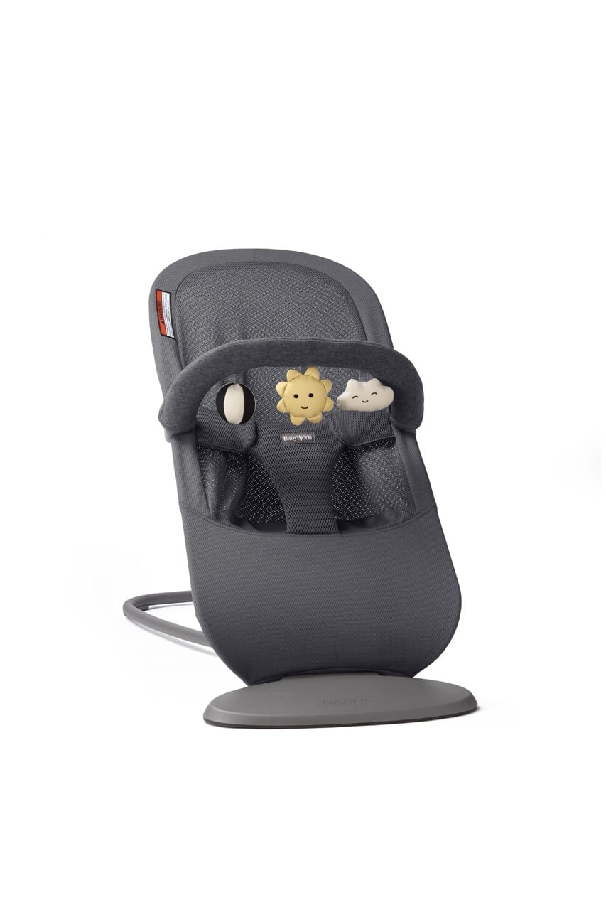 BabyBjorn bouncer in dark grey with a toy bar featuring a sun and cloud