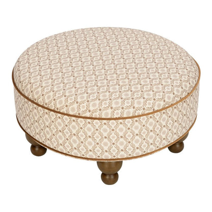 Babyletto round ottoman with tan patterned fabric and dark wood ball feet