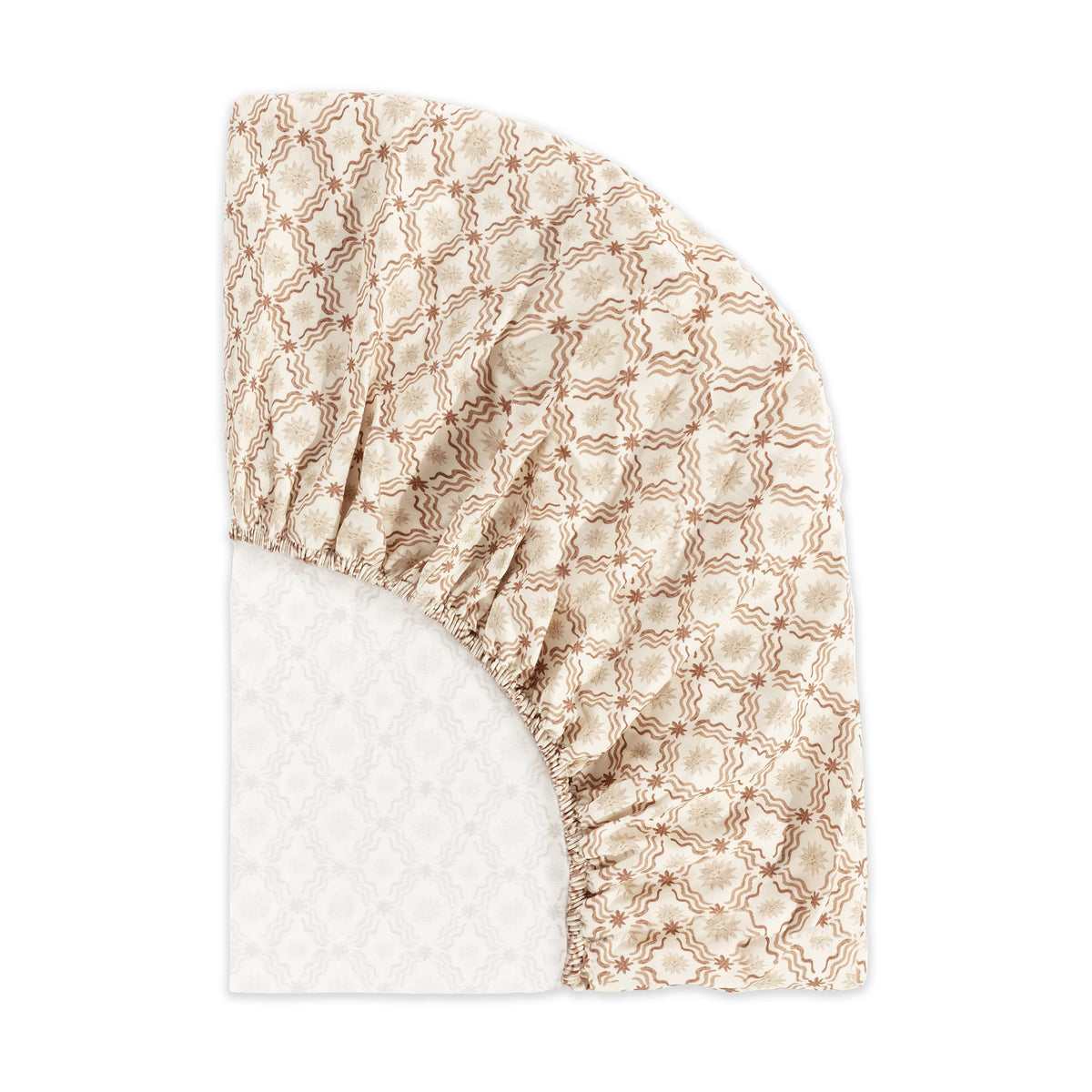 Babyletto fitted crib sheet with tan floral and wavy line pattern