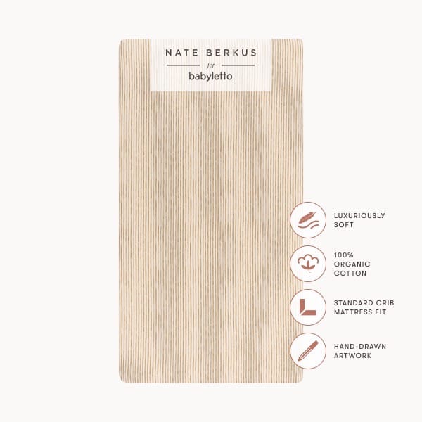 Babyletto Nate Berkus organic cotton crib sheet with vertical line pattern and product feature icons