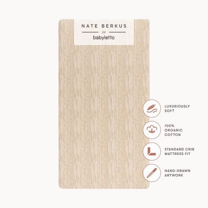 Babyletto Nate Berkus organic cotton crib sheet with vertical line pattern and product feature icons