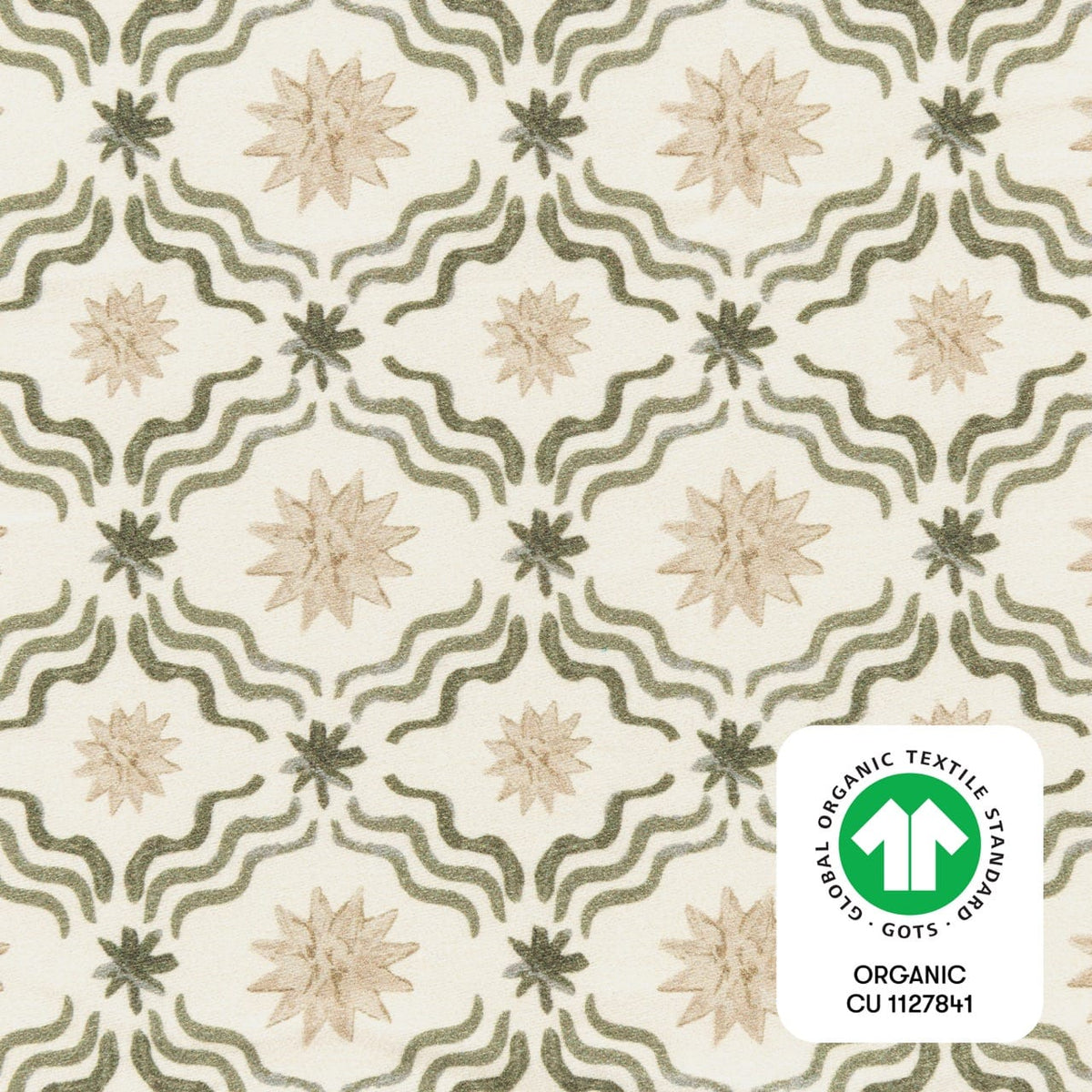 Babyletto fabric with green wavy lines and beige star patterns featuring a GOTS organic certification label