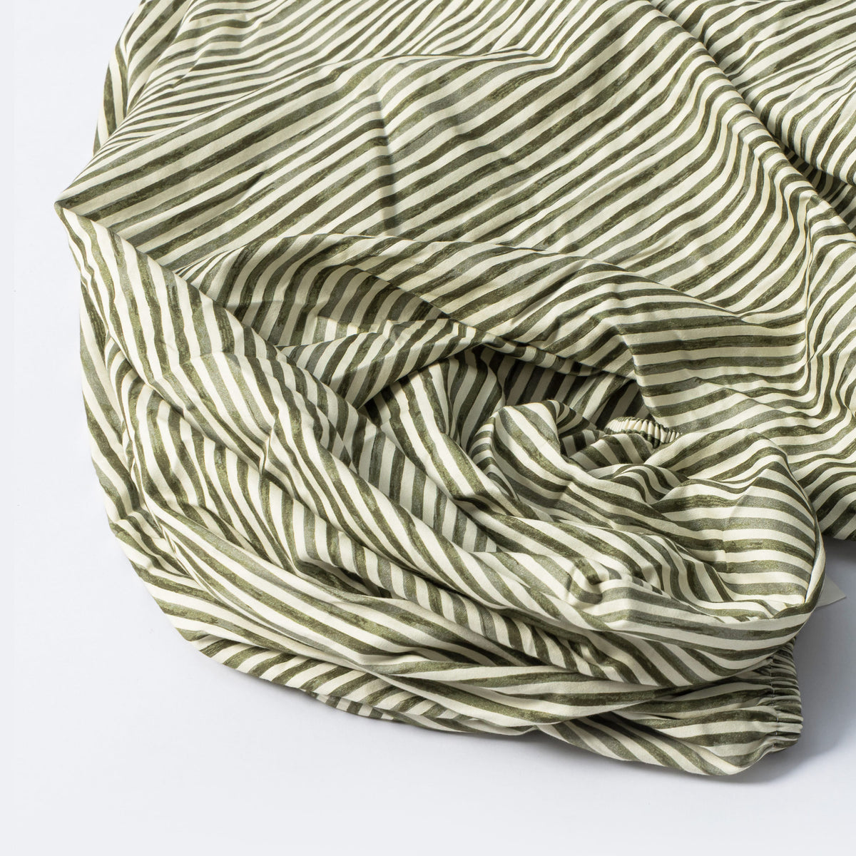 Babyletto fitted crib sheet with olive green and white diagonal stripes