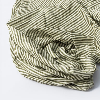 Babyletto fitted crib sheet with olive green and white diagonal stripes