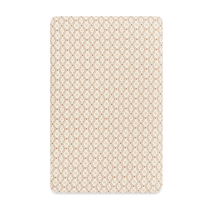 Babyletto crib sheet with a tan and white geometric diamond and floral pattern