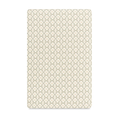 Babyletto crib sheet with a beige and olive green geometric lattice pattern