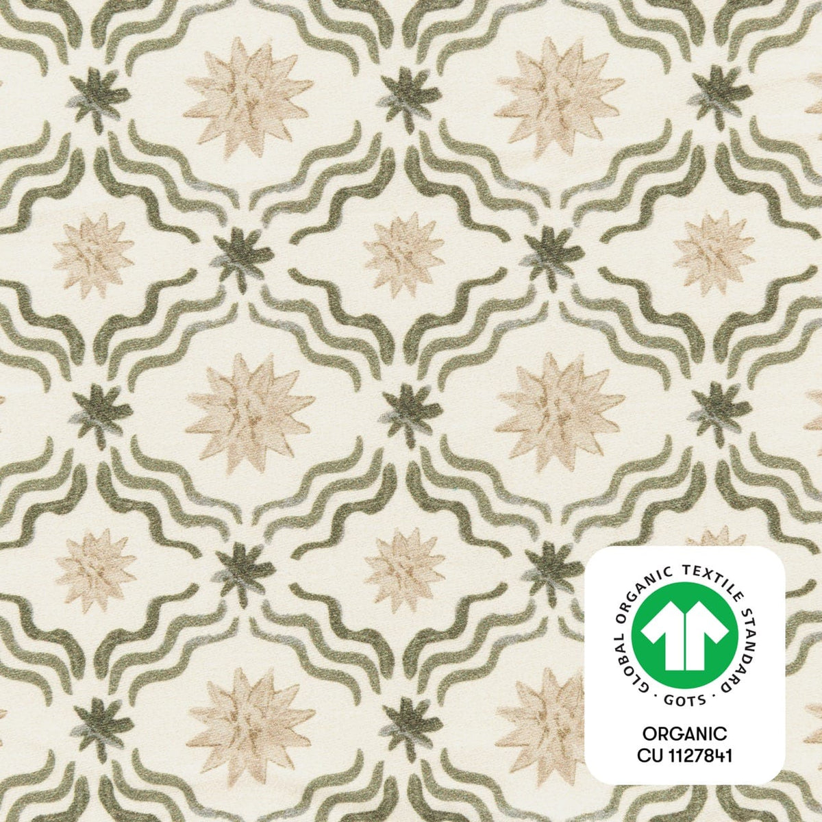 Babyletto fabric with green wavy lines and tan star patterns featuring a GOTS organic textile certification label