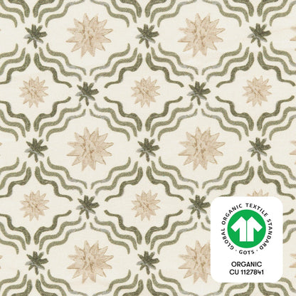Babyletto fabric with green wavy lines and tan star patterns featuring a GOTS organic textile certification label