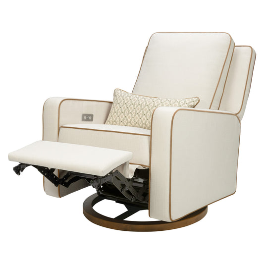 Babyletto cream swivel glider recliner with brown piping and patterned lumbar pillow