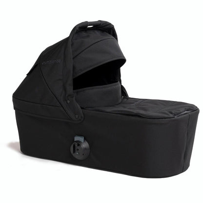 Black Bumbleride bassinet with canopy and side view, featuring a padded interior and secure attachment mechanism.