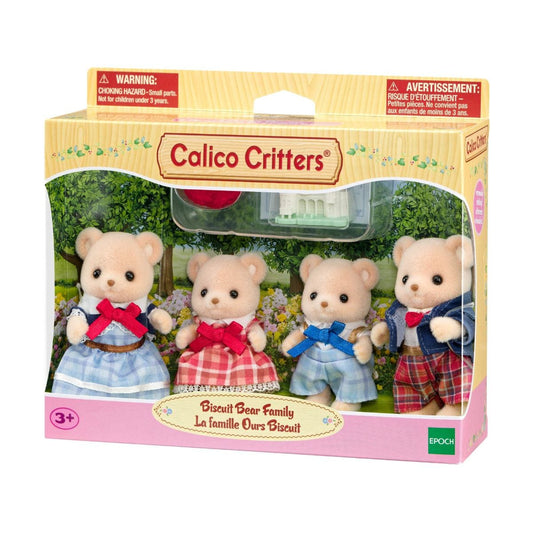 Four Calico Critters bear figures in outfits with a small toy castle