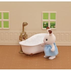 Sylvanian Families rabbit figure standing next to a miniature bathtub with a shower attachment