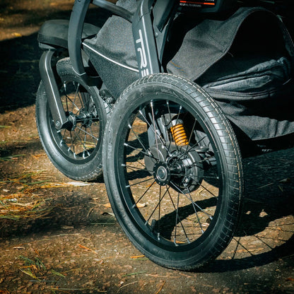 Close up of Chicco stroller wheels with suspension