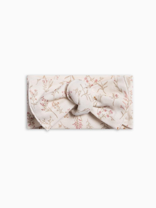Colored Organics knotted baby headband in cream with a pink and green floral print
