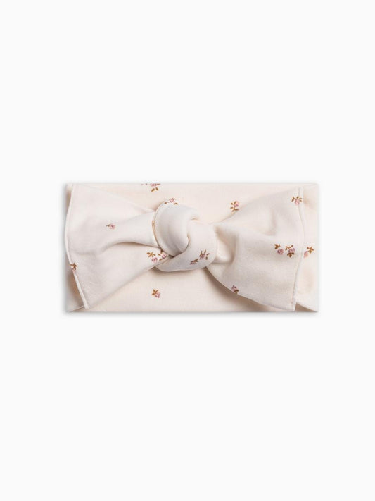 Colored Organics cream headband with a knotted bow and small floral print