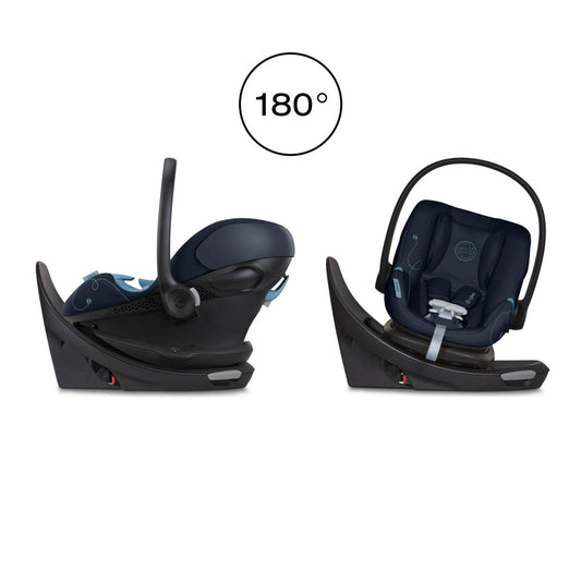 Ocean blue rotating infant car seat by Cybex with swivel base, padded navy upholstery, light blue stitching, and black frame in side view