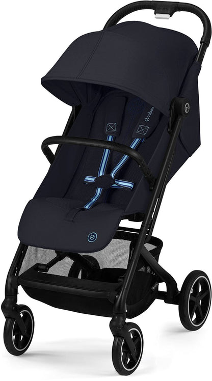 Dark blue compact stroller by Cybex with black frame, blue-accented harness, mesh storage basket, and four wheels, front three-quarter view