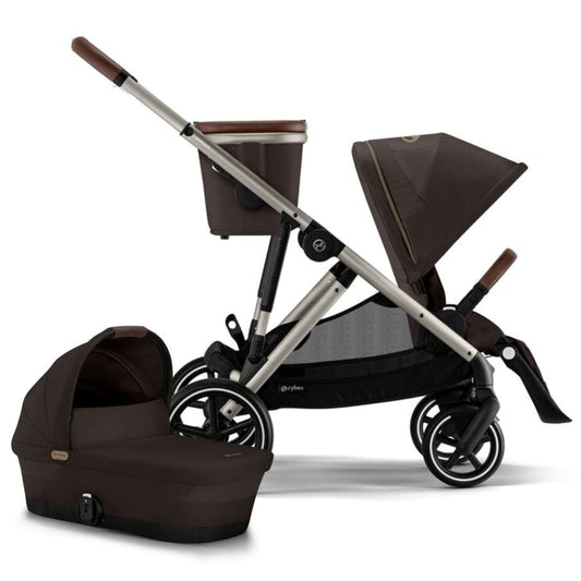 Cybex brown stroller with a matching carrycot and seat unit