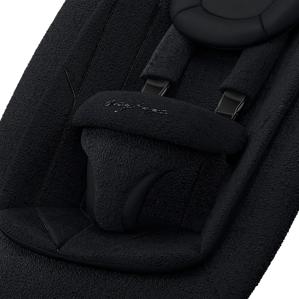 Cybex bouncer seat with black textured fabric and safety harness