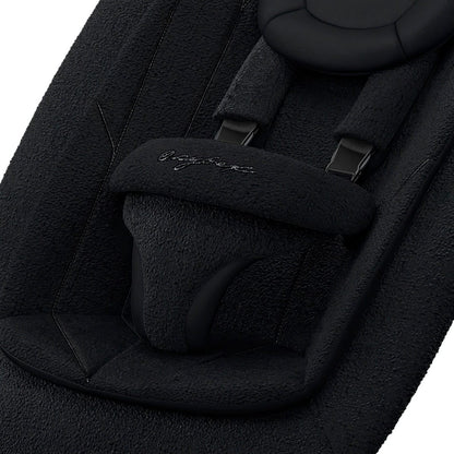 Cybex bouncer seat with black textured fabric and safety harness