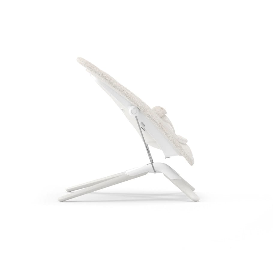 Side view of Cybex baby bouncer in beige