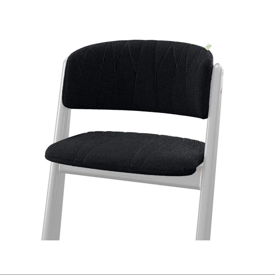 Black upholstered chair with white frame and textured seat and backrest