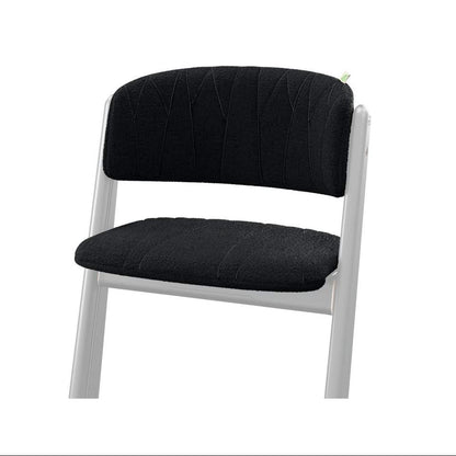 Black upholstered chair with white frame and textured seat and backrest