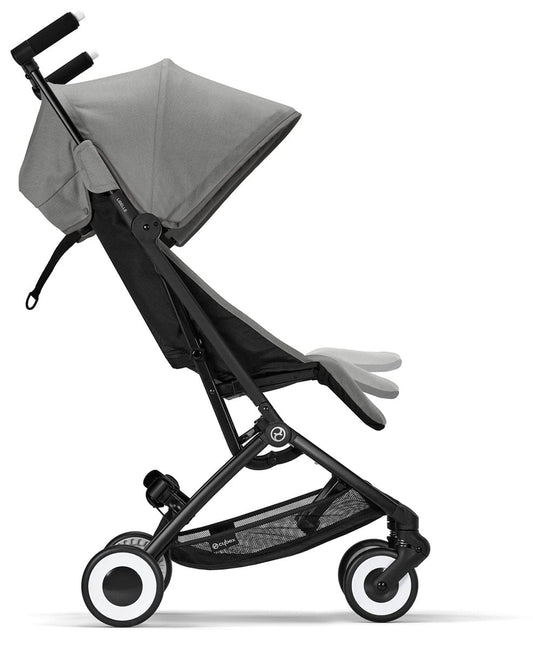 Lava grey compact stroller by Cybex with black frame, orange-accented harness, and white-rimmed wheels, front-facing view