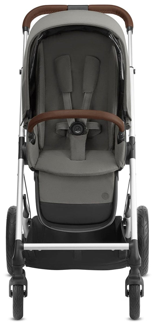 Soho Grey all-terrain stroller by Cybex with silver frame, brown leatherette handles, and black wheels, shown in front three-quarter view