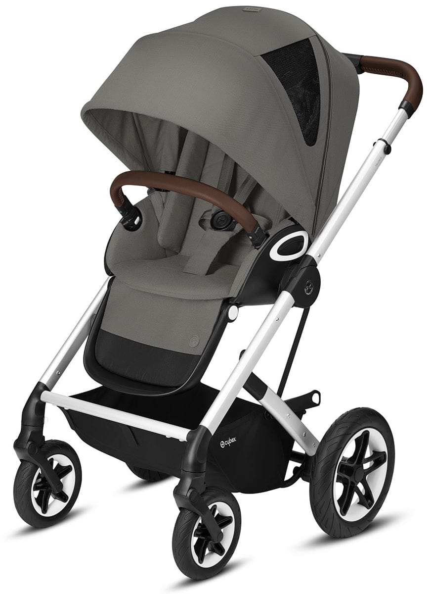 Soho Grey all-terrain stroller by Cybex with silver frame, brown leatherette handles, and black wheels, shown in front three-quarter view