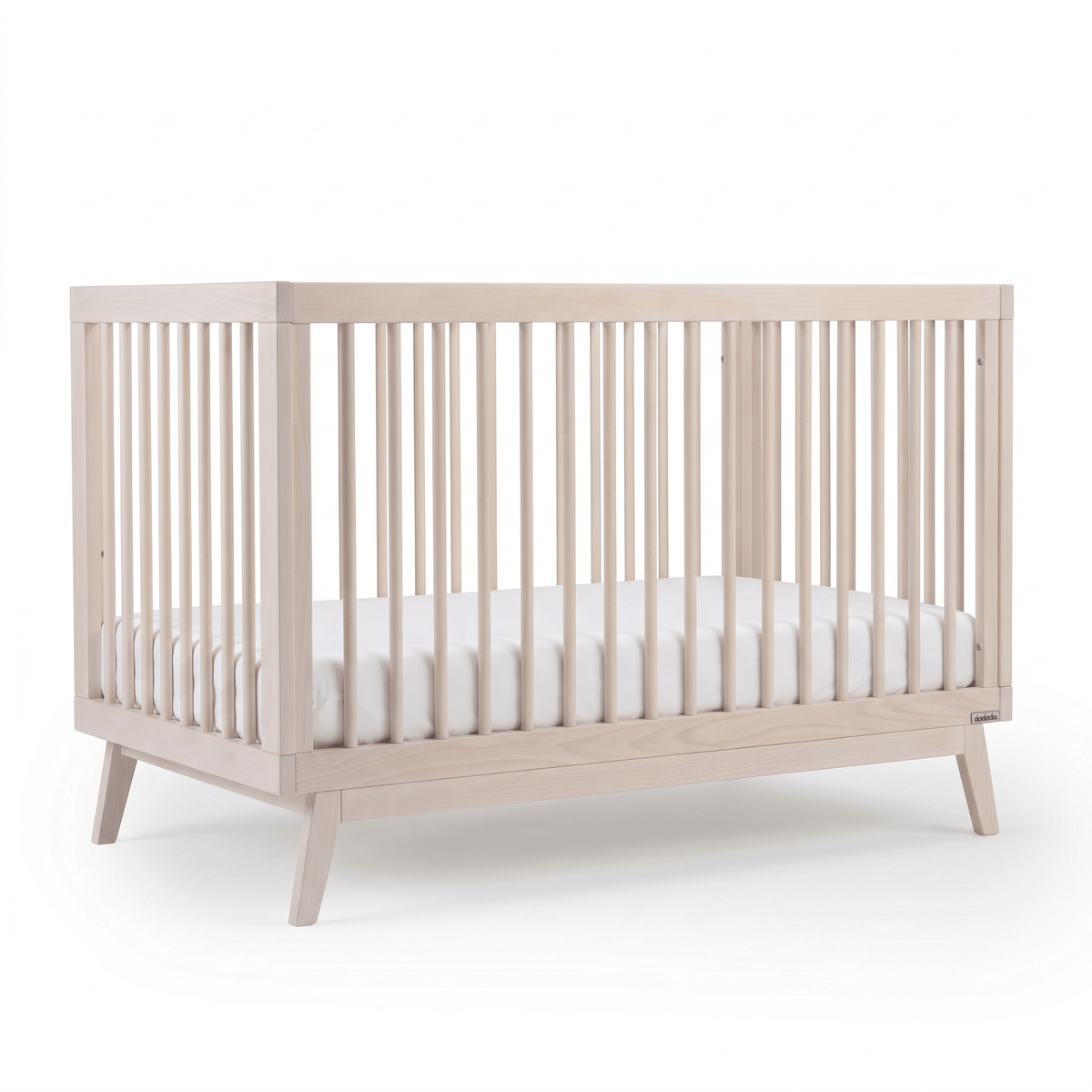 Dadada natural wood crib with slatted sides and white mattress