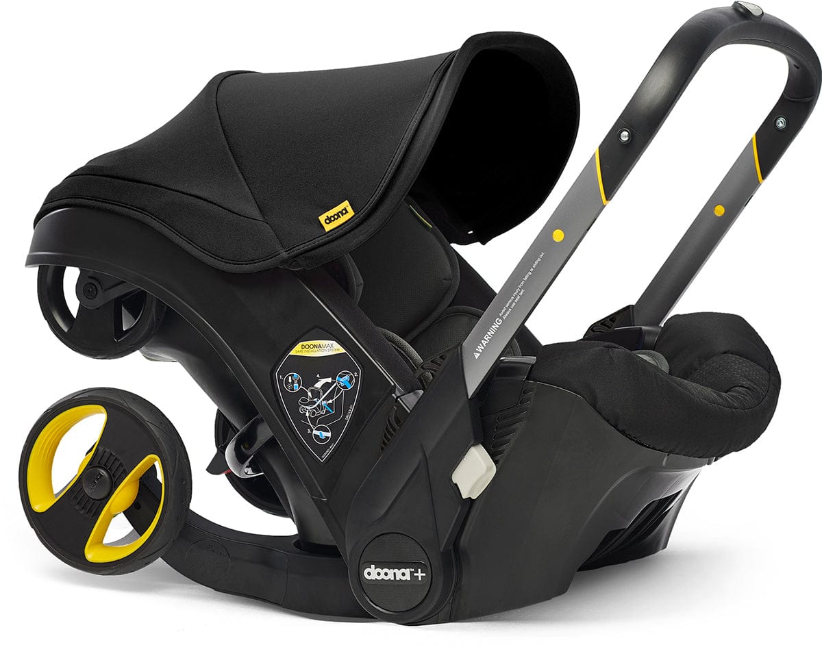 Doona+ Infant Car Seat & Stroller with Handlebar Cover Bundle - Nitro Black / Brown Leather - SP101-10-033-003-SP147-10-025-003