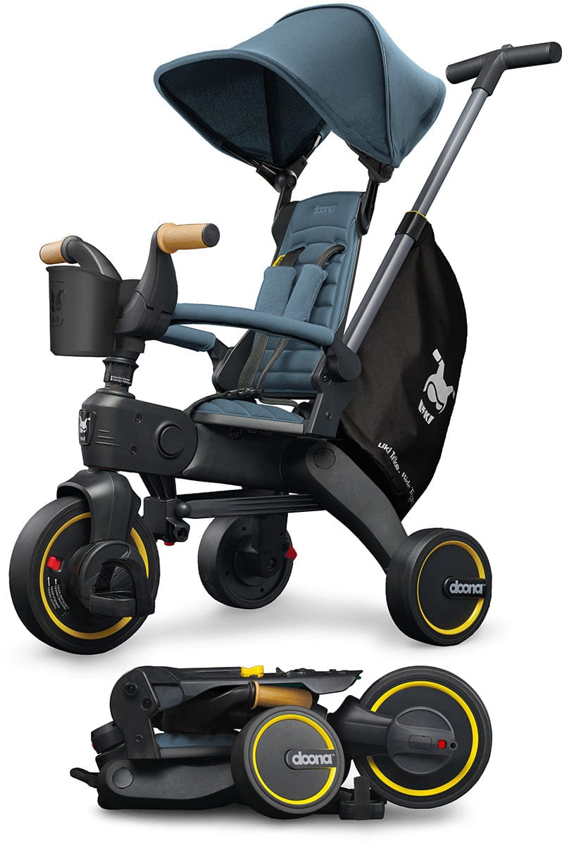 Ocean blue Doona Liki Trike S5 by Doona, featuring black frame, yellow-accented wheels, and foldable design with canopy and storage basket.