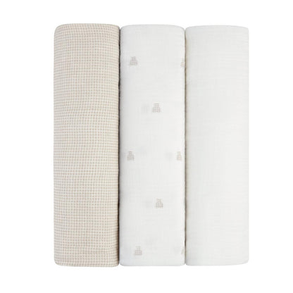 Three folded Ely's & Co muslin swaddle blankets in beige gingham and white with bear patterns