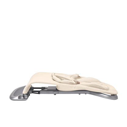 Side view of a beige baby bouncer in a flat folded position