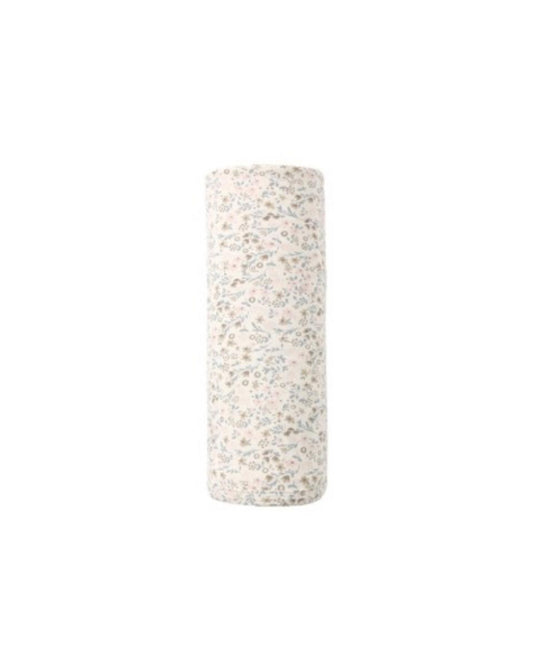Rolled baby swaddle blanket with a cream background and small floral print