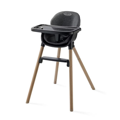 Graco high chair with black seat and tray on light wood legs