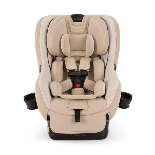 Nuna convertible car seat in beige with five point harness and cup holders
