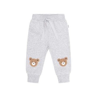 Huxbaby grey sweatpants with bear face patches on knees