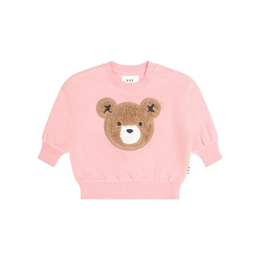 Huxbaby pink long sleeve sweatshirt with a brown faux fur bear face applique