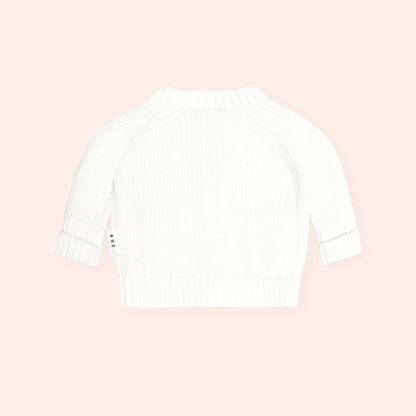 White Huxbaby long sleeve knit sweater with ribbed cuffs and hem