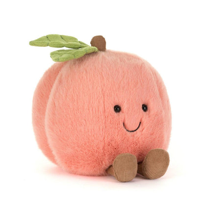 Jellycat plush peach toy with green leaf and brown corduroy feet