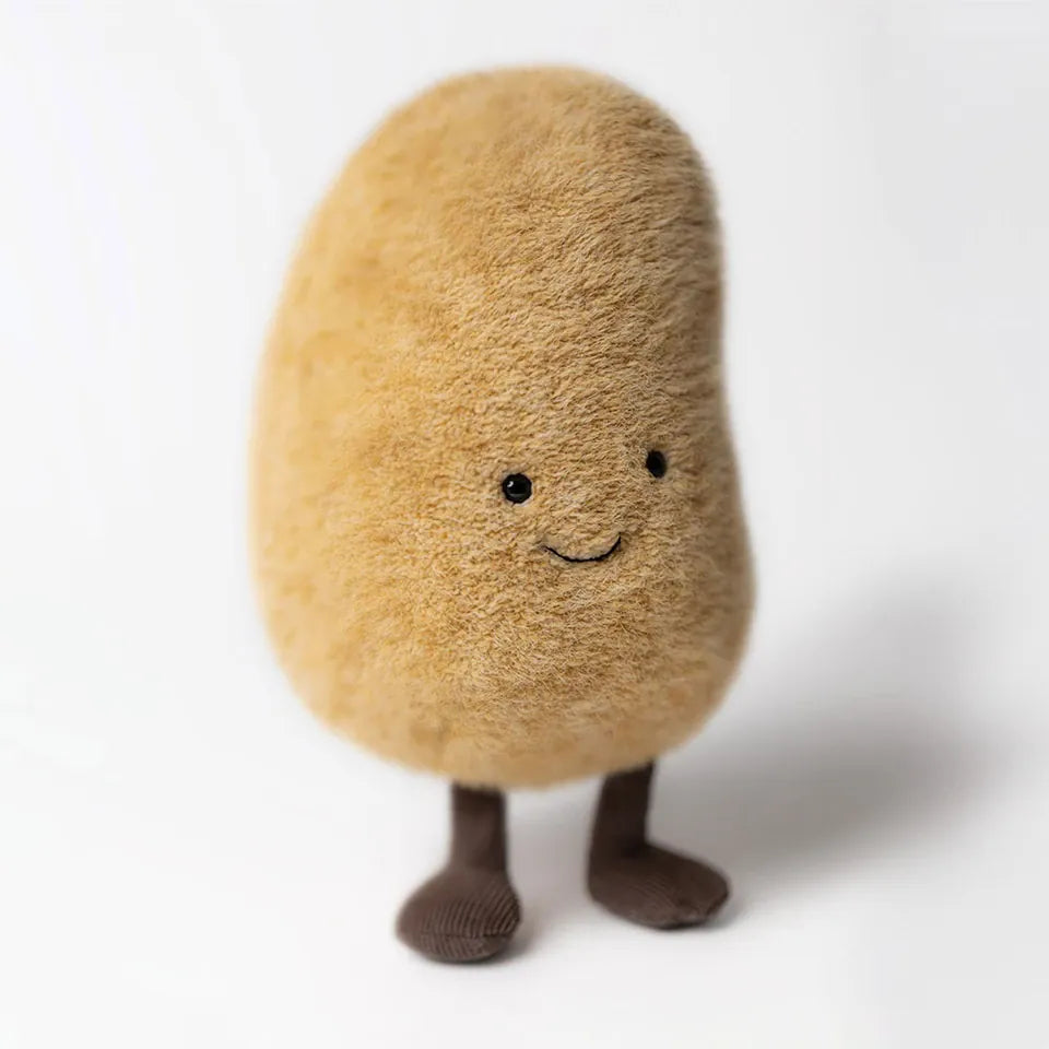 Jellycat Amuseable potato plush toy with brown fuzzy texture and small dark feet