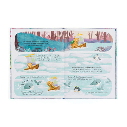 Open children book pages showing a teddy bear in a boat navigating through ice with whales and a penguin