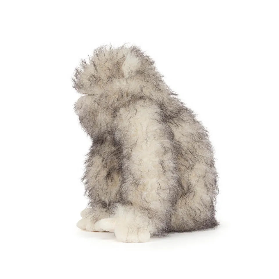Jellycat plush toy gorilla with shaggy grey and white fur in profile view