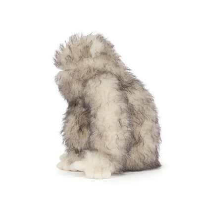 Jellycat plush toy gorilla with shaggy grey and white fur in profile view